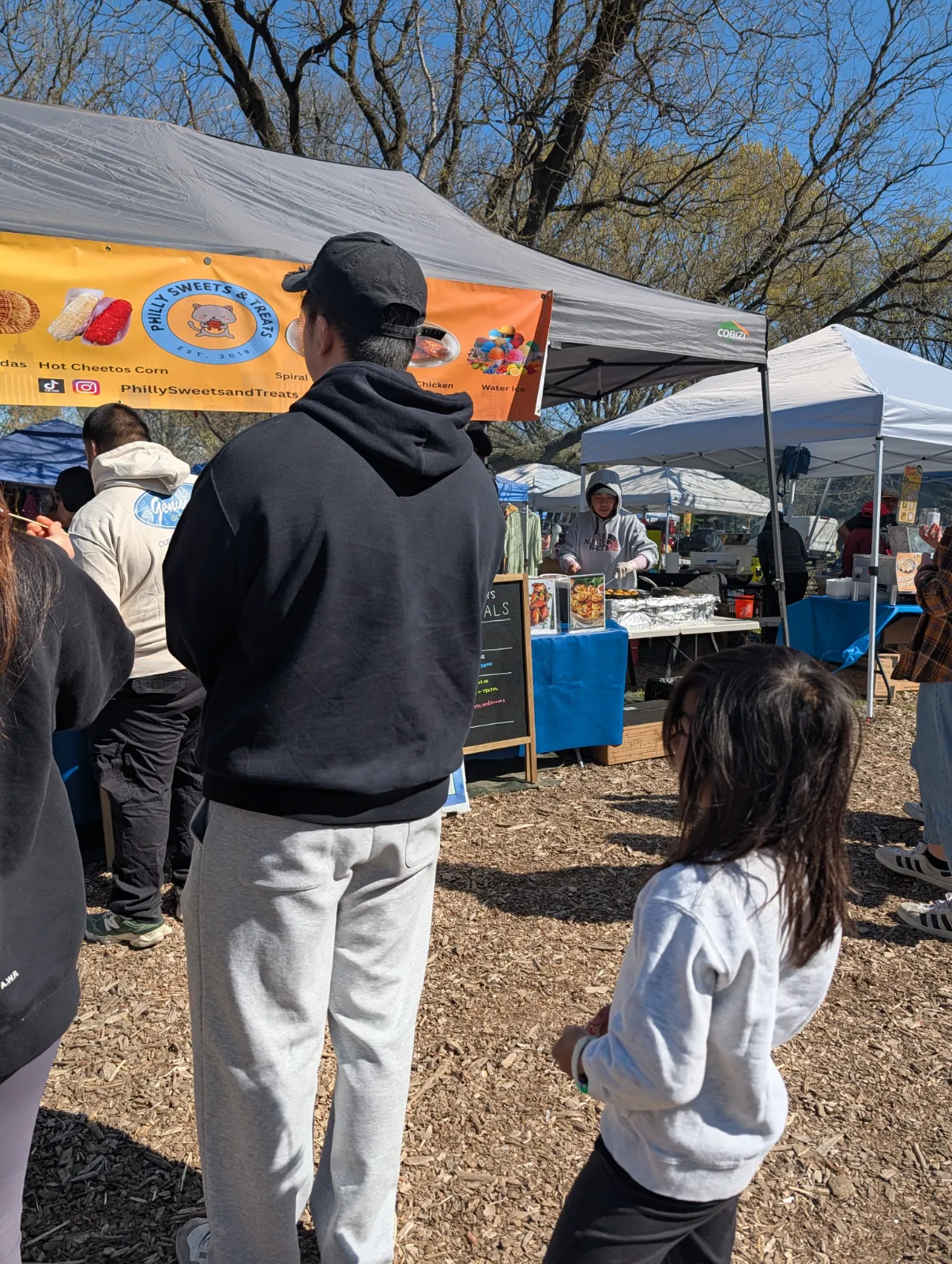 Charlotte waiting in a long line at the market