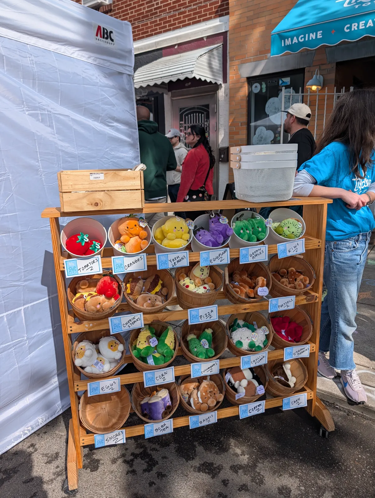 Plush food items on display at a vendor booth