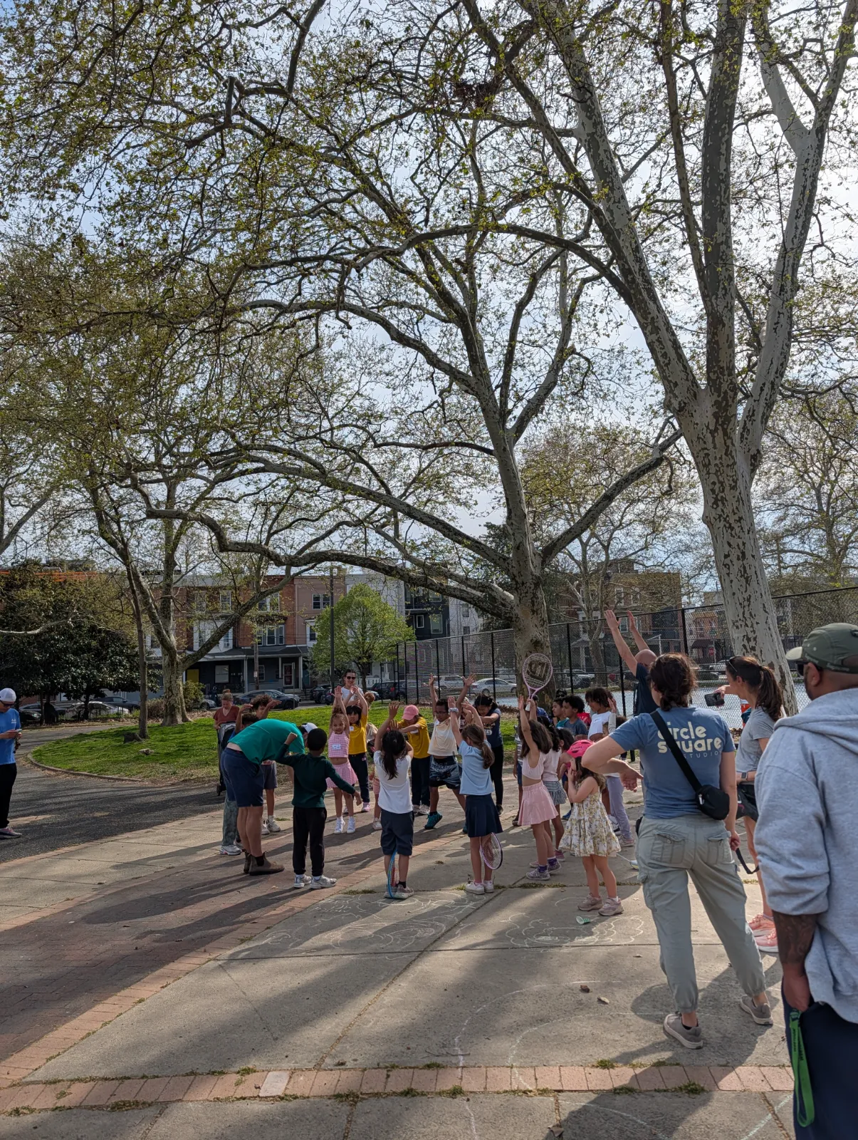 Charlotte practicing her swing during tennis camp