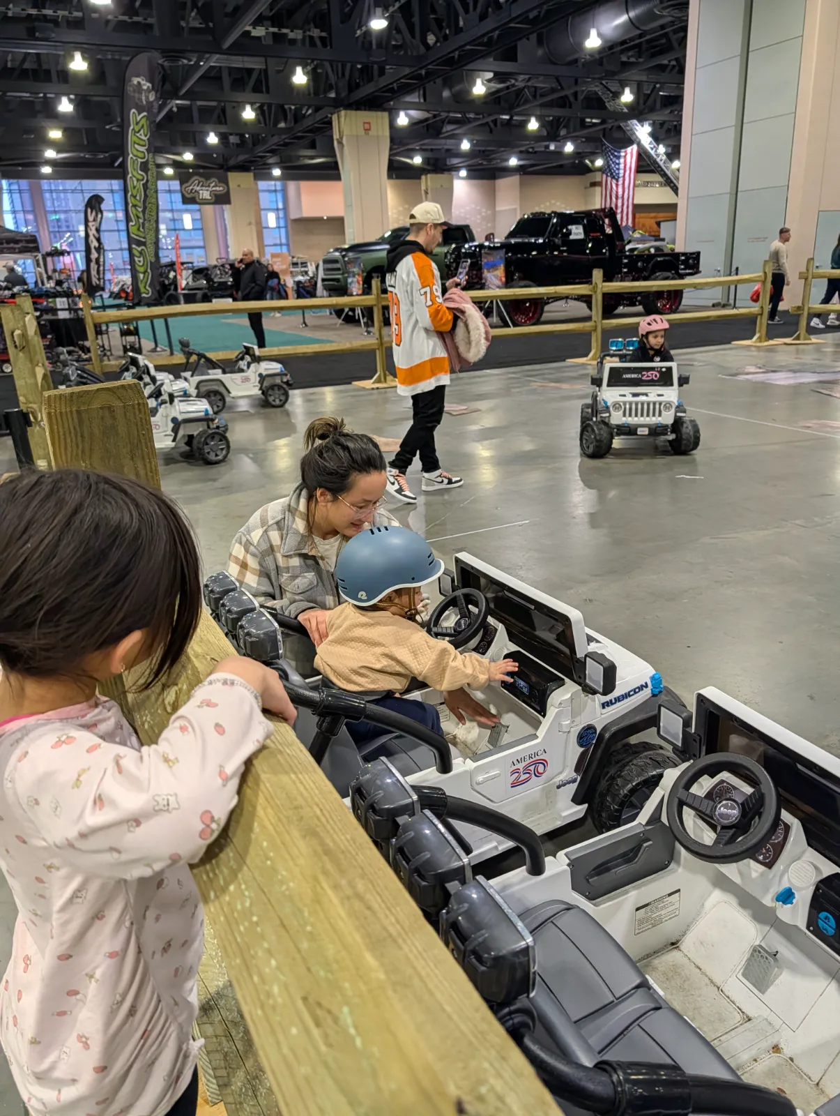 Kids driving toy cars on the mini Jeep course at the Philadelphia Auto Show