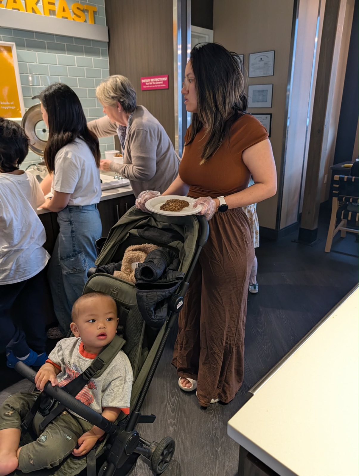 Abby and Parker at the Tru by Hilton breakfast buffet
