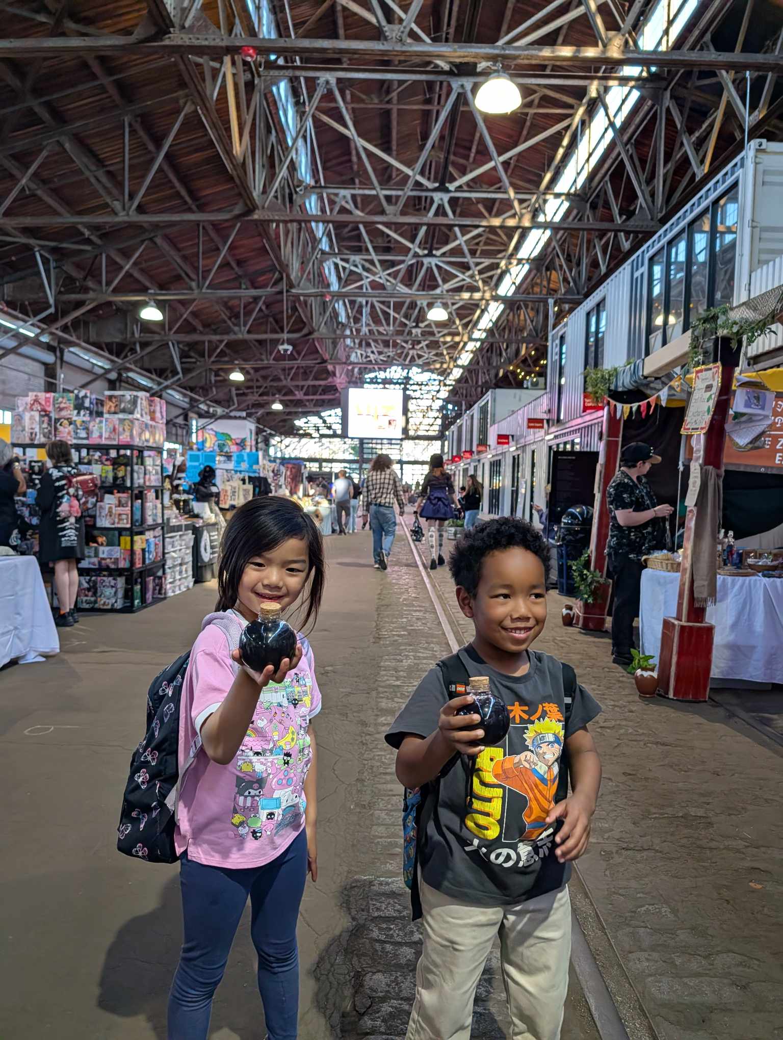 Kids holding their Mana Potion lemonades at Otaku Fest