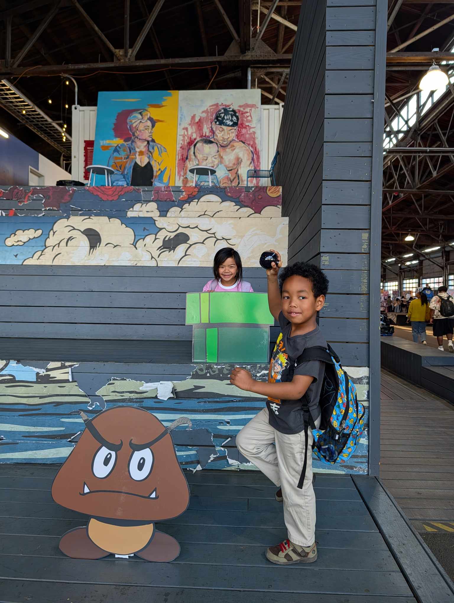 Kids in the lounge area with Super Mario cutouts at Cherry Street Pier