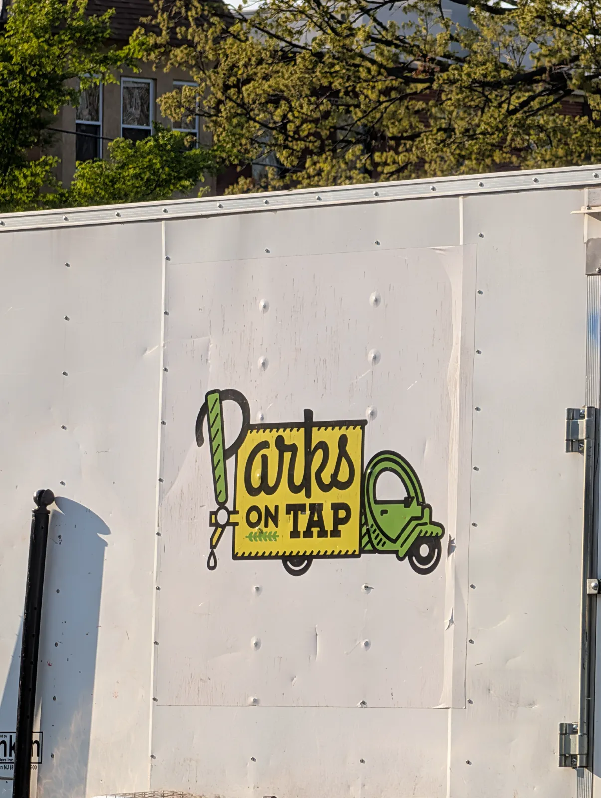 Parks on Tap logo featuring a playful truck and greenery design