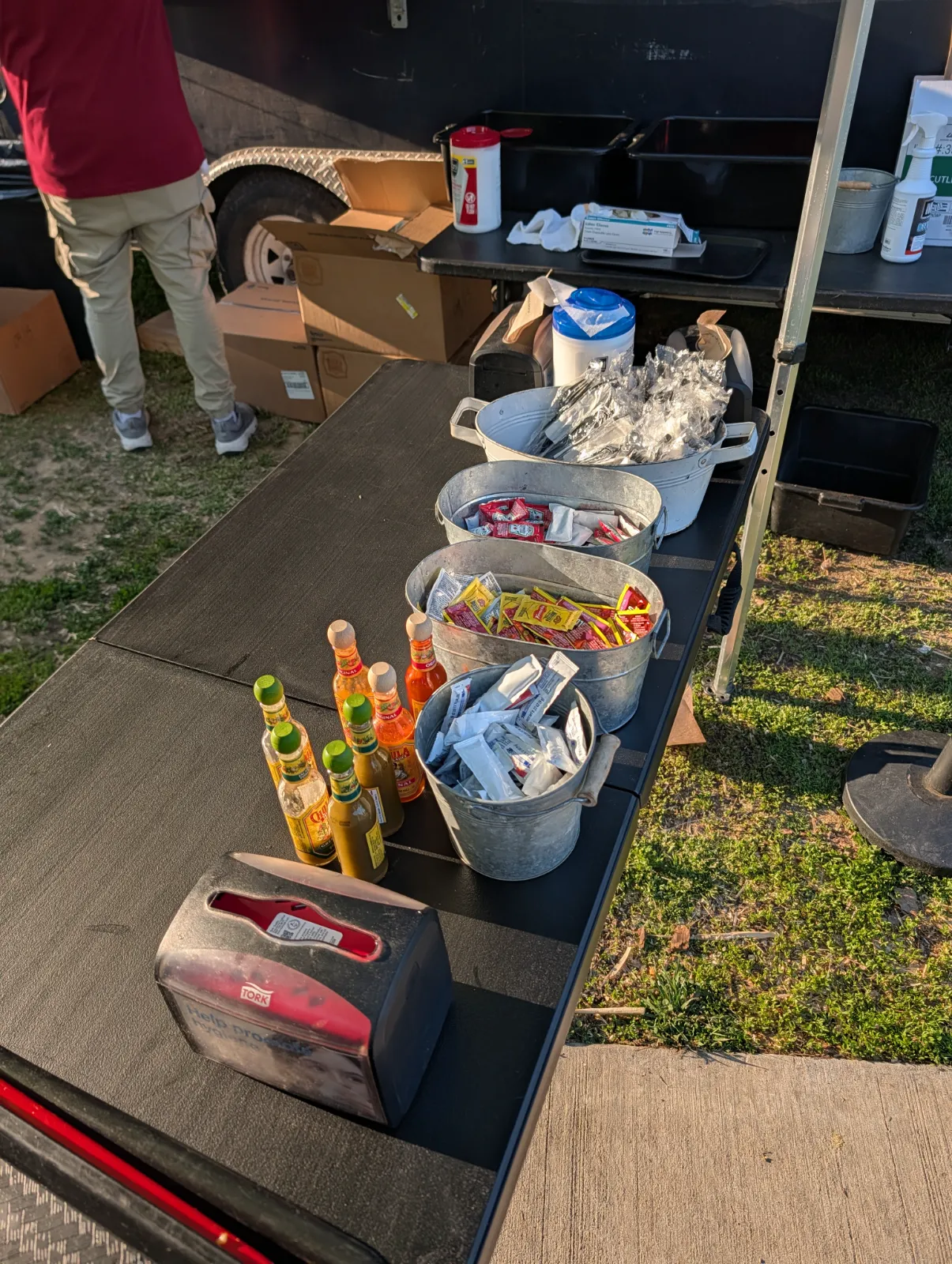 Condiment station at Parks on Tap with sauces, napkins, and utensils