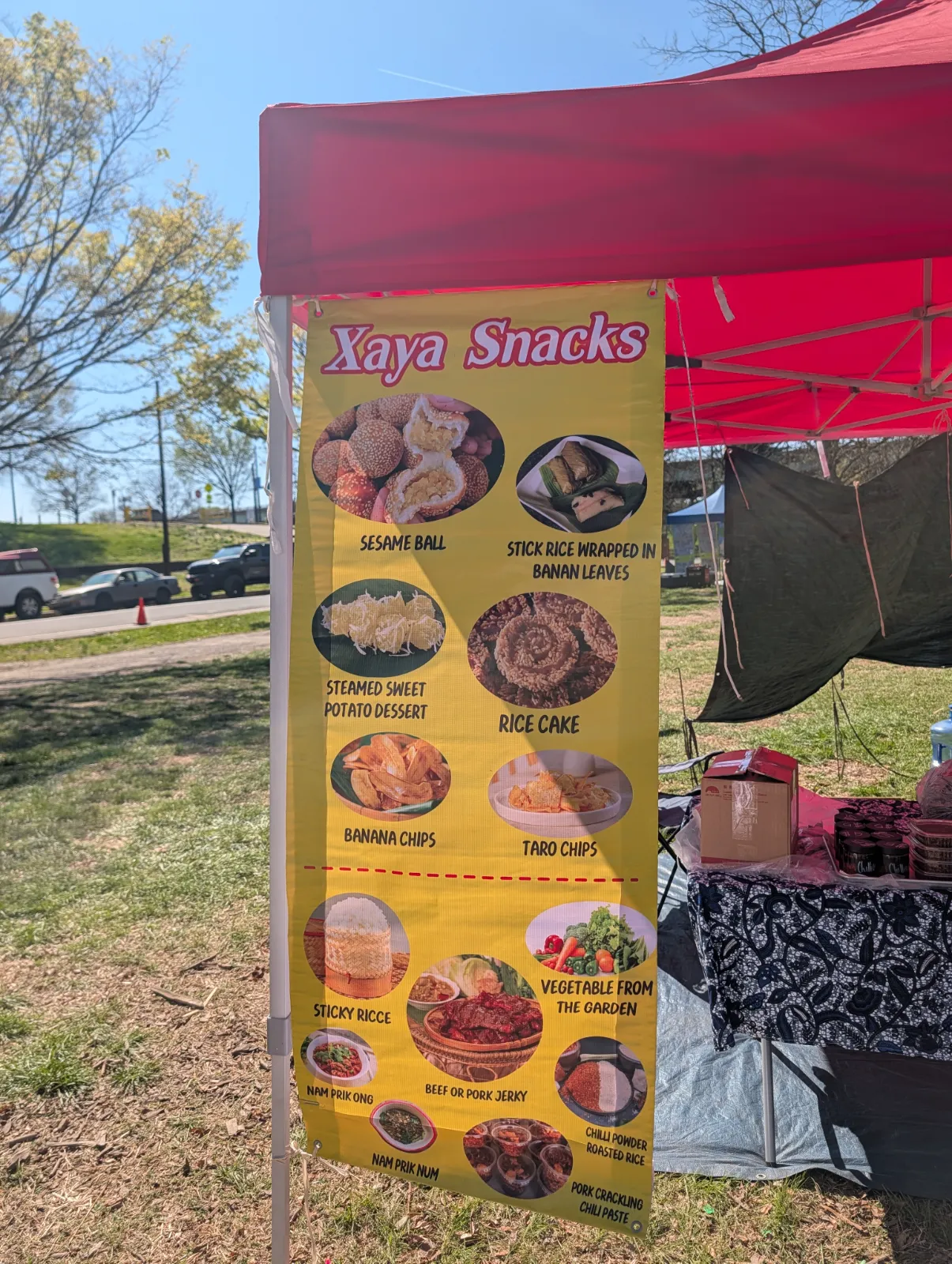 Street food snacks including taro chips, banana chips, sesame balls, and sticky rice in banana leaves