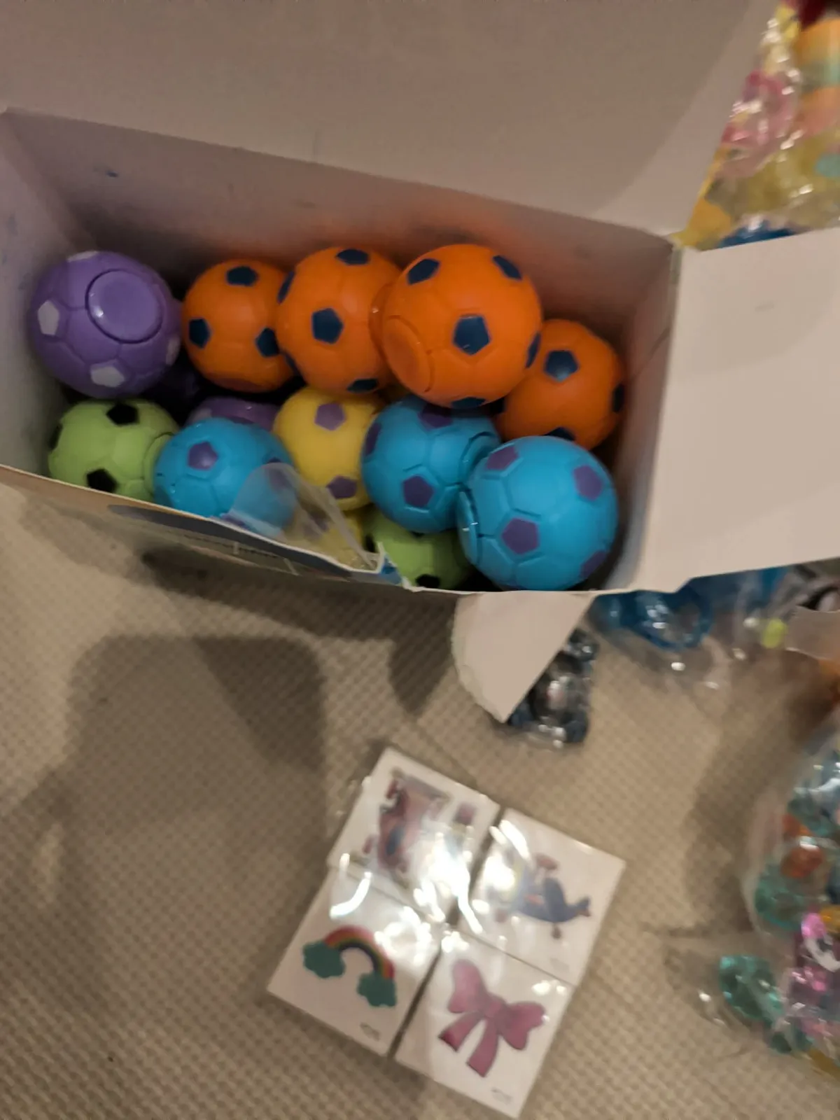 Mini soccer balls and colorful stickers for Easter egg stuffing