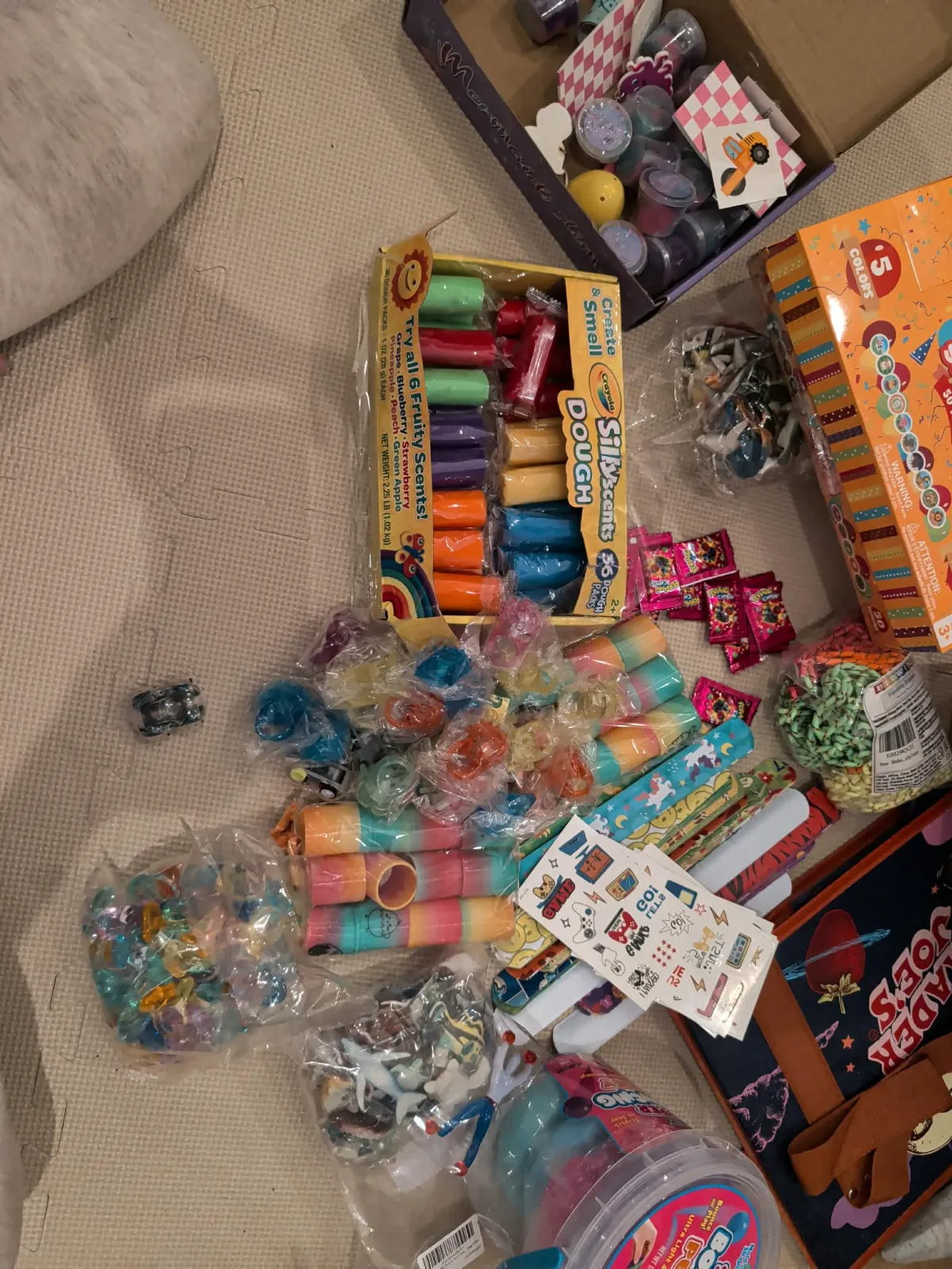 Scented dough, colorful toys, and fun accessories for Easter egg stuffing